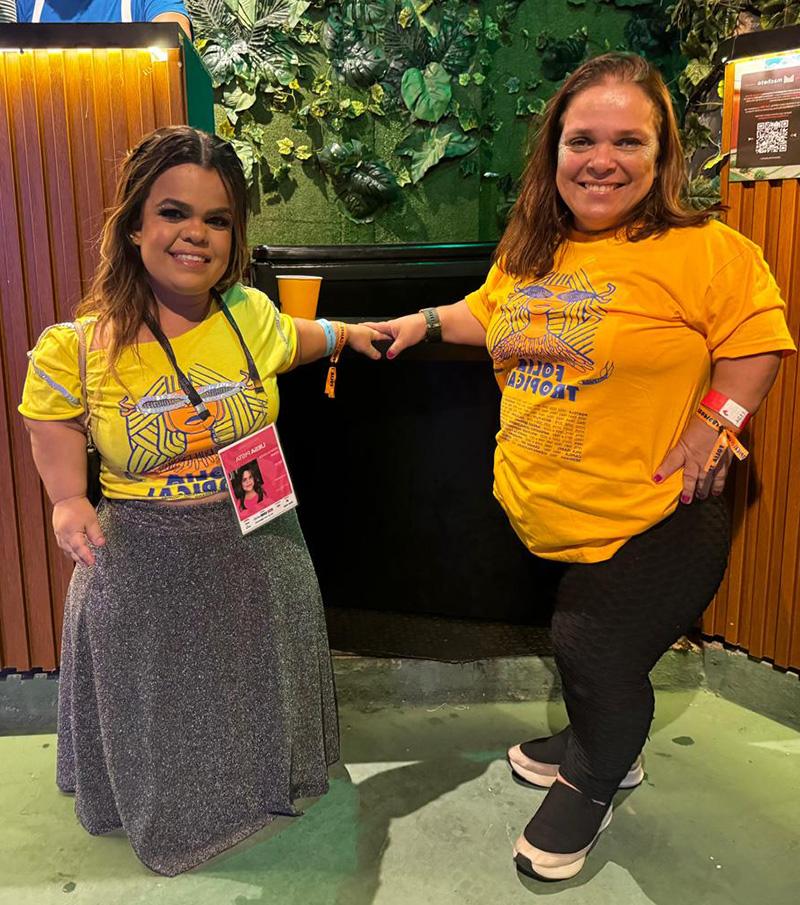 Kenia Rio and Rebeca Costa standing in front of a lowered bar counter at Carnival